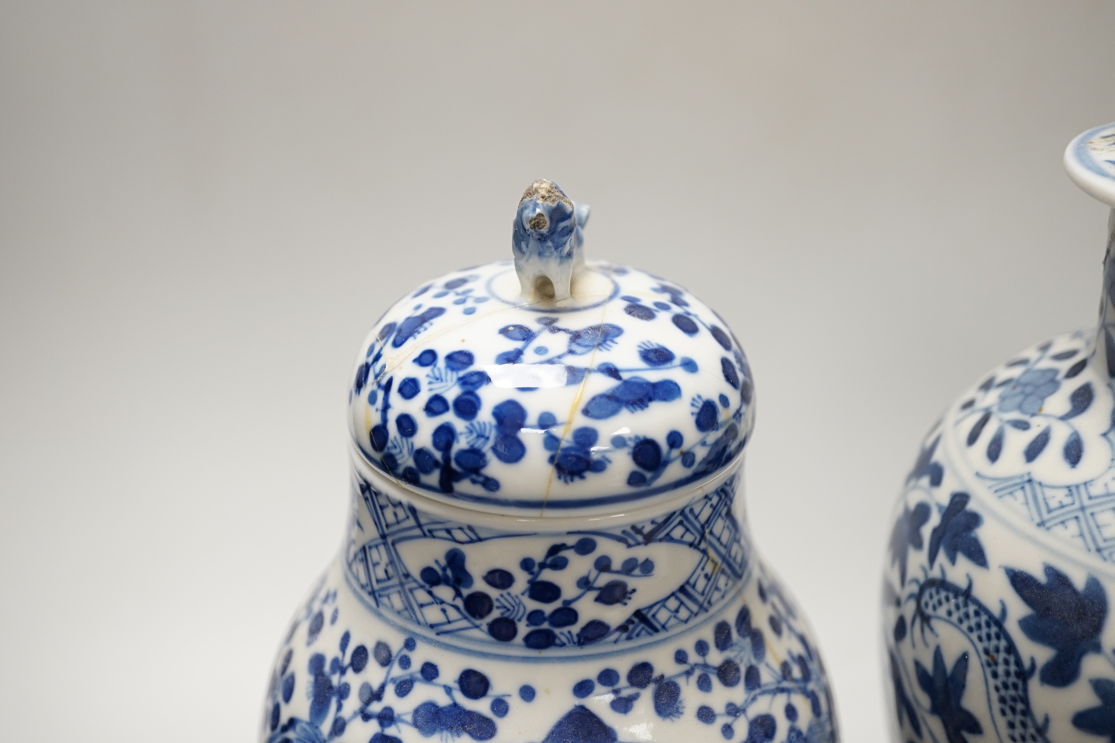 A Chinese blue and white ‘dragon’ vase and cover, and another, tallest 32cm; some damage